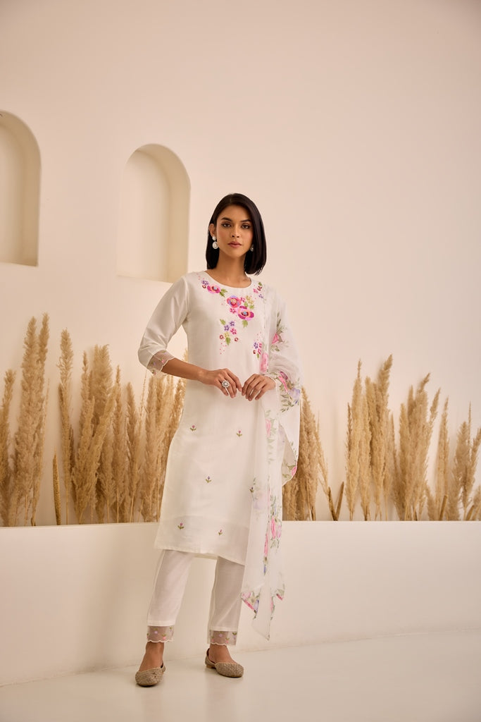 Neerus White Straight Embellished Kurta And Trousers With Dupatta.