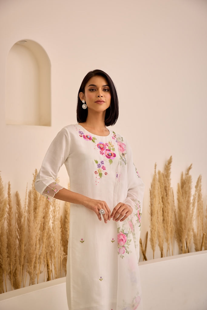 Neerus White Straight Embellished Kurta And Trousers With Dupatta.