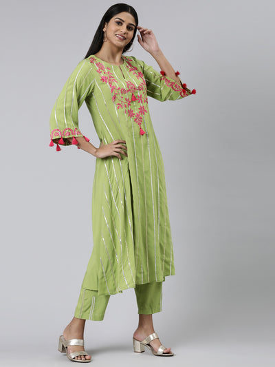 Neeru's Green Regular Calf Length Solid Kurta Solid Trousers