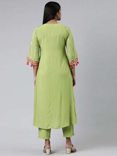 Neeru's Green Regular Calf Length Solid Kurta Solid Trousers